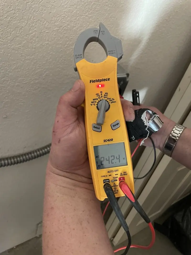 Voltage testing with clamp meter during Generator Installation in Salem Heights